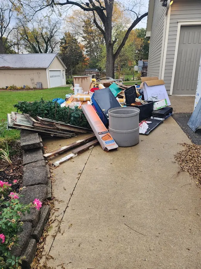 Dumpster being loaded with debris for Commercial Dumpster Rental in Carolina Shores